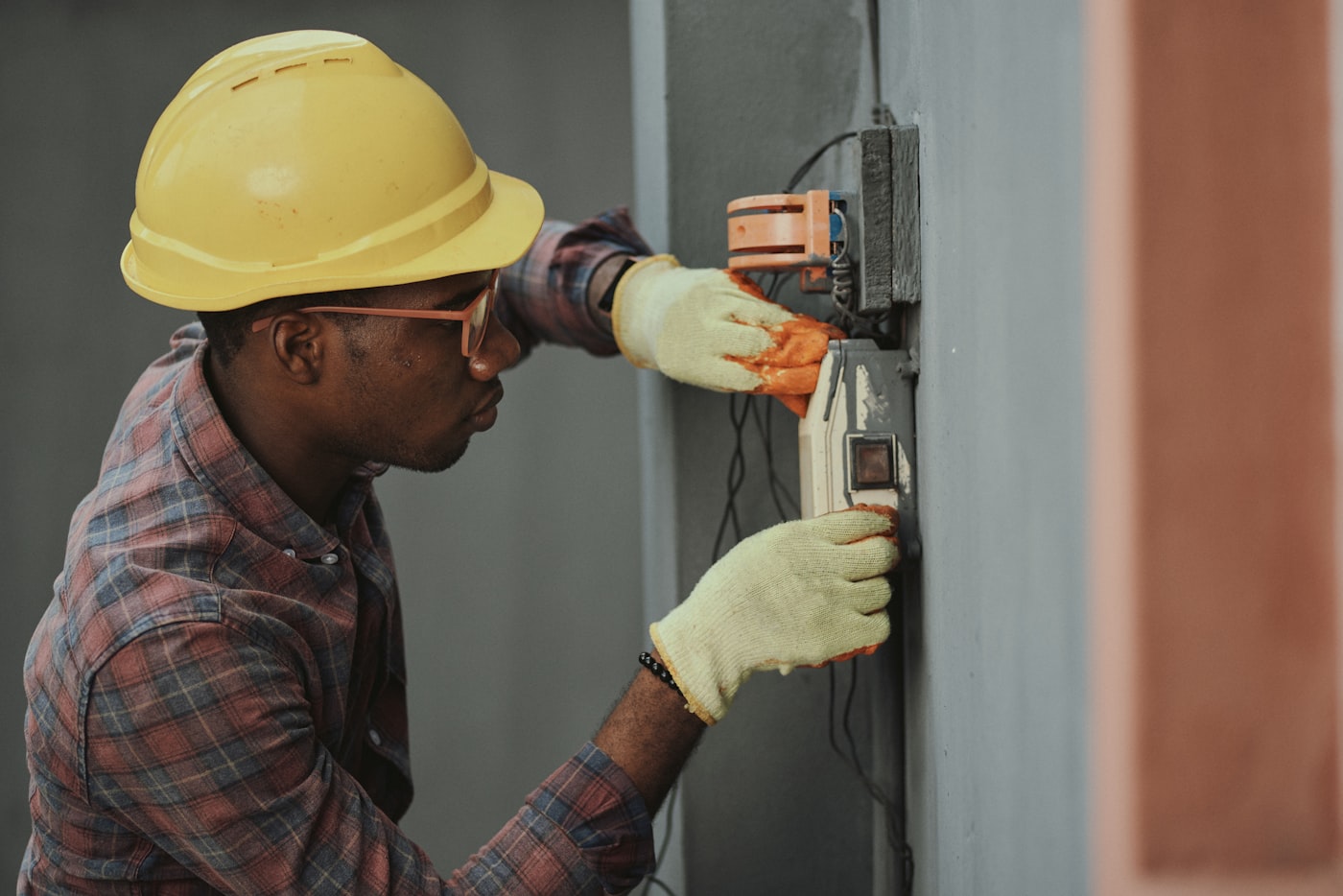 An HVAC technician at work on a unit